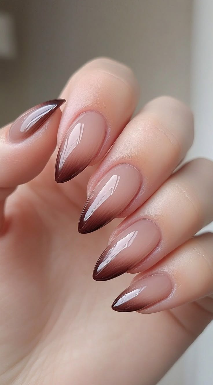 Long stiletto nails with espresso-brown ombré tips fading to nude