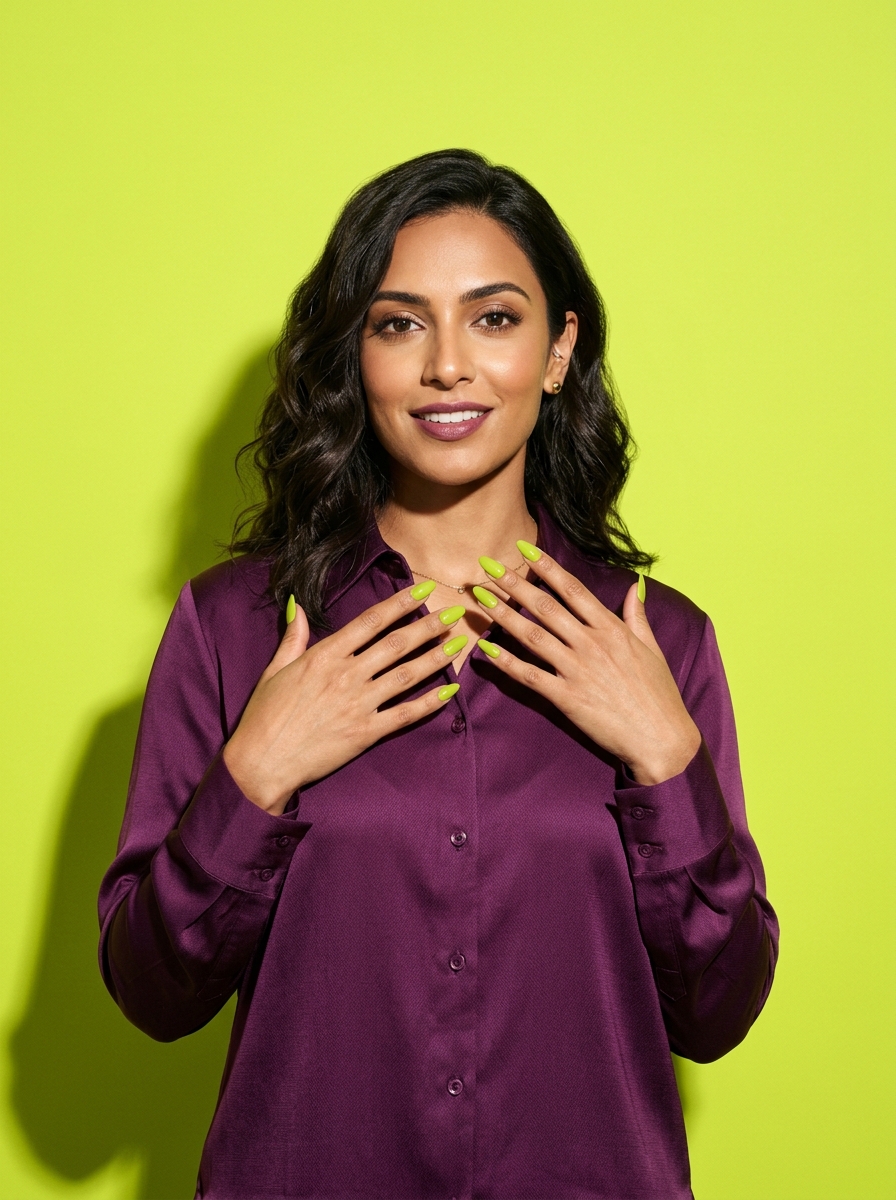 Portrait of Renée against a lime backdrop